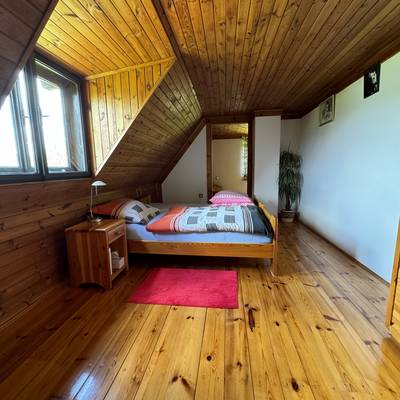 Prodej nemovitosti s panoramatickým výhledem na Lipenskou přehradu se stavebními pozemky.